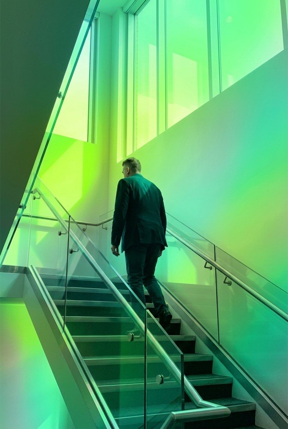 Man walking up a staircase